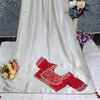 Graceful White Jacquard Saree with Red Embroidered Blouse