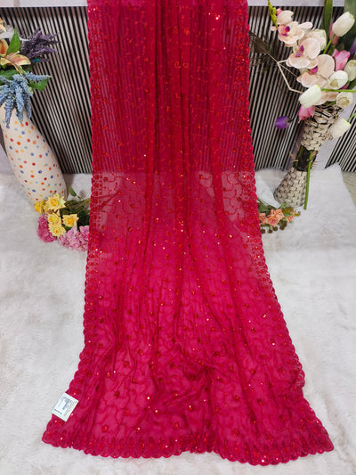 Dazzling Rani Pink Sequin Embellished Net Saree for Festive Glamour