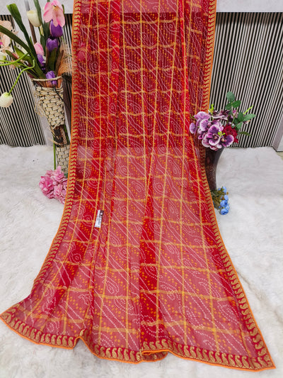 Charming Fiery Red Printed Georgette Saree with Bandhani Checks