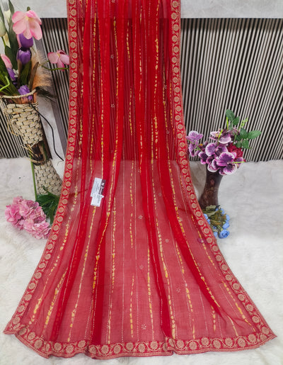 Graceful Fiery Red Printed Saree with Bandhani Stripe Design