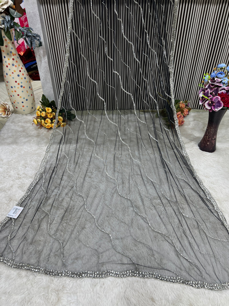 Glamorous Black Net Saree with Wavy Silver Sequin Embellishments