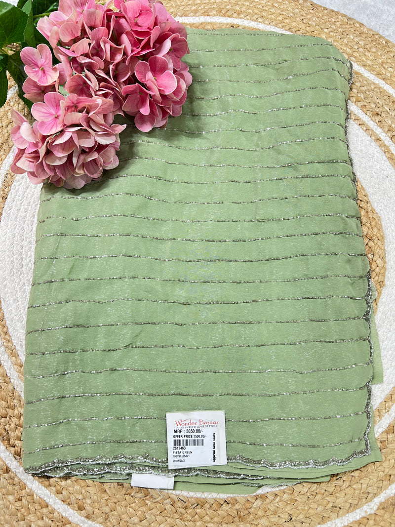 Graceful Pista Green Georgette Saree with Fine Silver Sequin Detailing