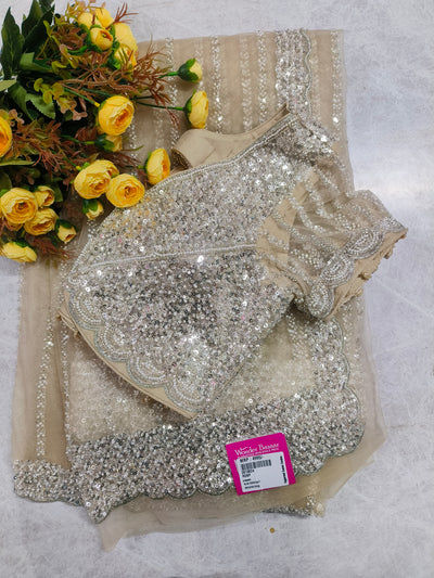 Luminous Cream Net Saree with Shimmering Silver Sequin and Scalloped Borders