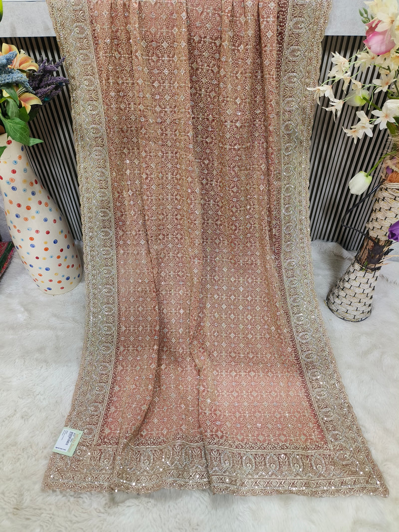 Exquisite Peach Georgette Fancy Saree with All-Over Intricate Gold Embroidery
