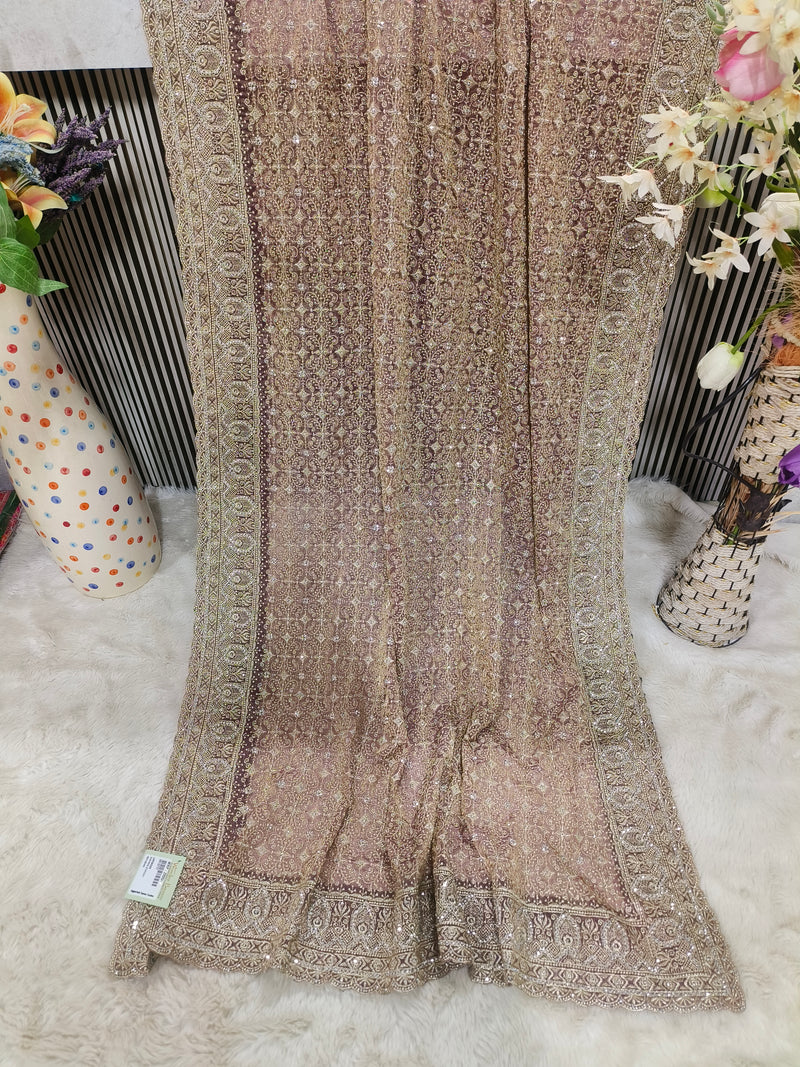 Exquisite Peach Georgette Fancy Saree with All-Over Intricate Gold Embroidery