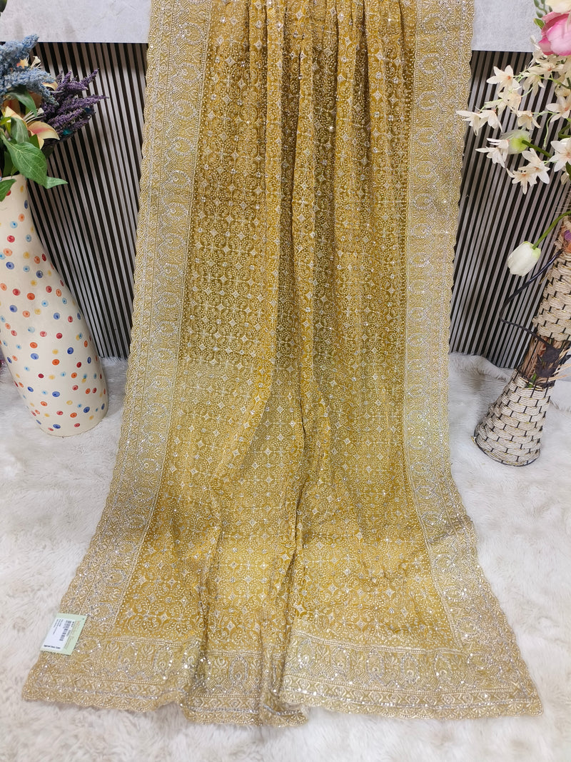 Exquisite Peach Georgette Fancy Saree with All-Over Intricate Gold Embroidery