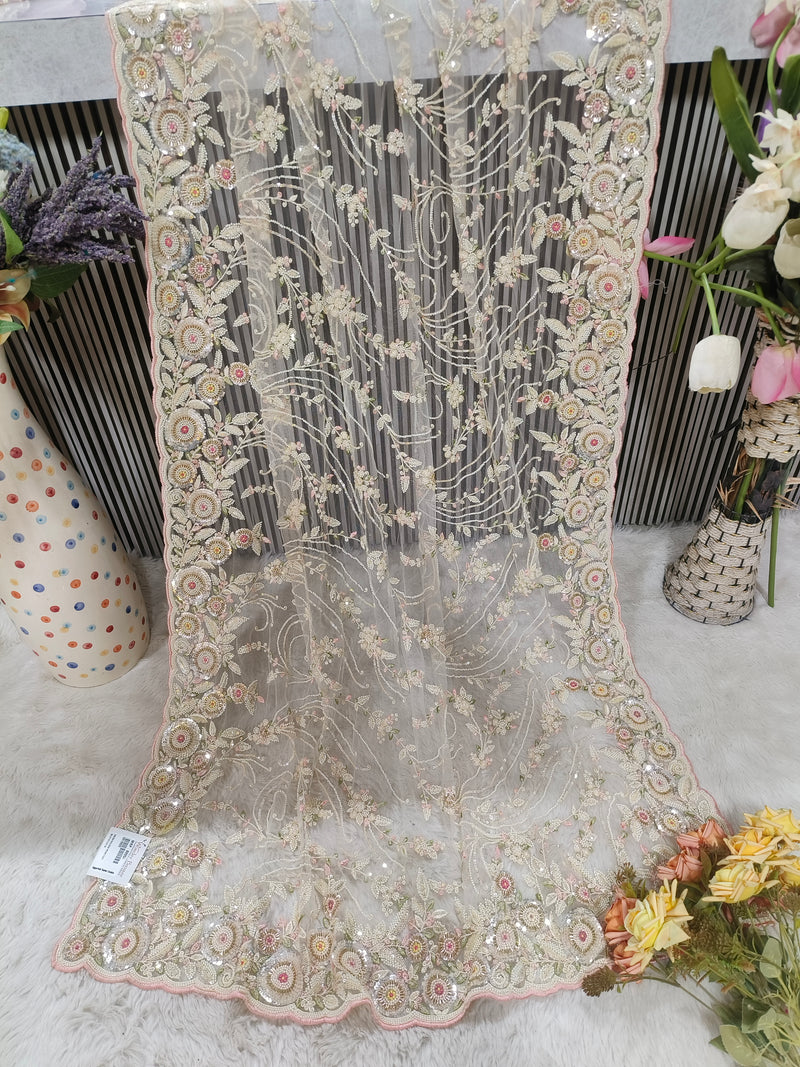 Enchanting Pastel Peach Floral Net Saree with Shimmering Sequin Detail