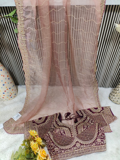 Glamorous Rose Dust Net Saree with Heavily Embroidered Wine Blouse