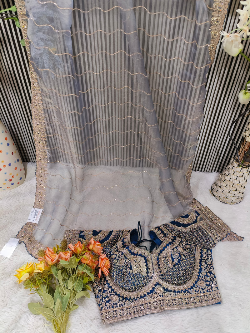 Glamorous Rose Dust Net Saree with Heavily Embroidered Wine Blouse
