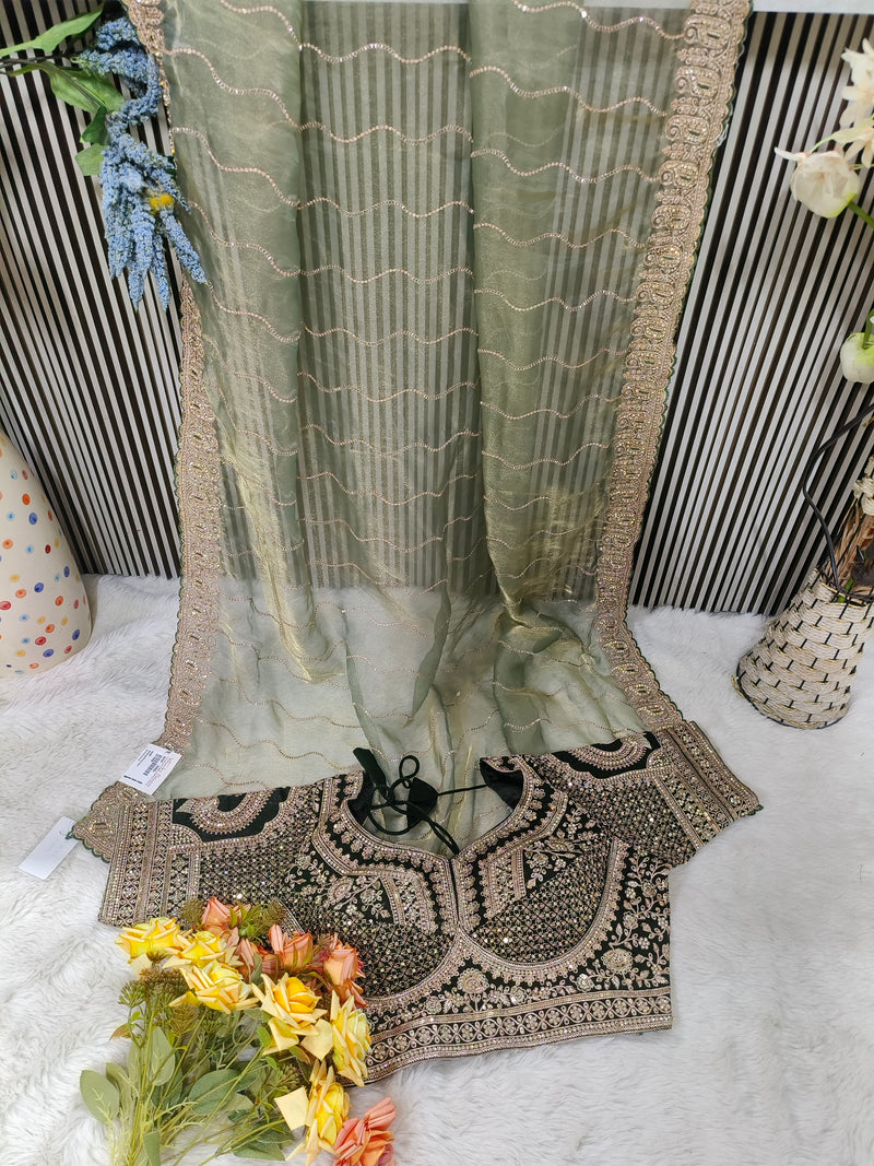 Glamorous Rose Dust Net Saree with Heavily Embroidered Wine Blouse