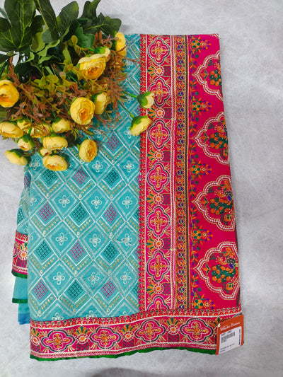 Vibrant Turquoise Georgette Saree with Rich Fuchsia Zari Border