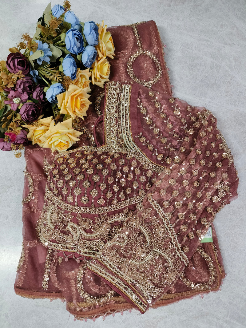 Elegant Beige Net Saree with Intricate Floral Sequin Embroidery