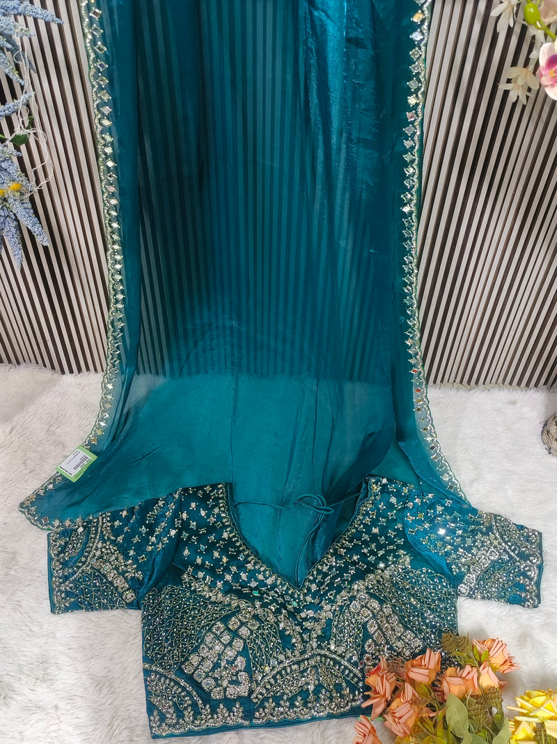 Shimmering Sage Green Organza Saree with Heavy Mirror Work Blouse