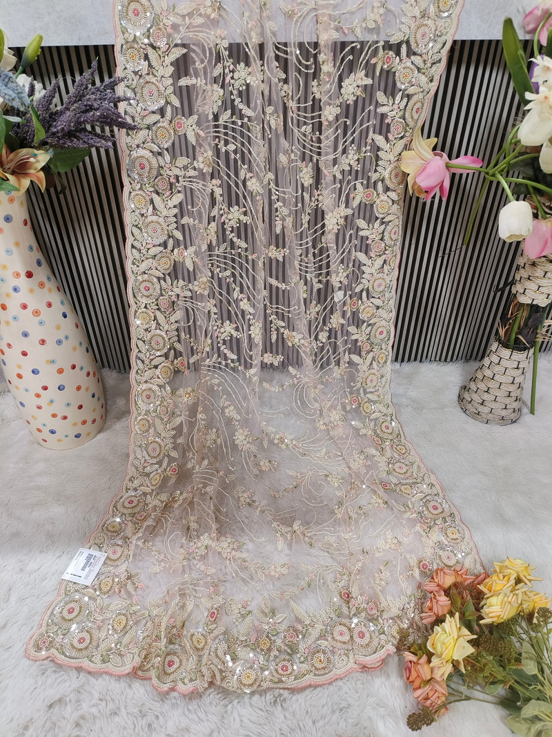Enchanting Pastel Peach Floral Net Saree with Shimmering Sequin Detail