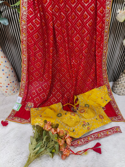 Traditional Red Bandhani Silk Saree with Contrasting Yellow Embroidered Blouse