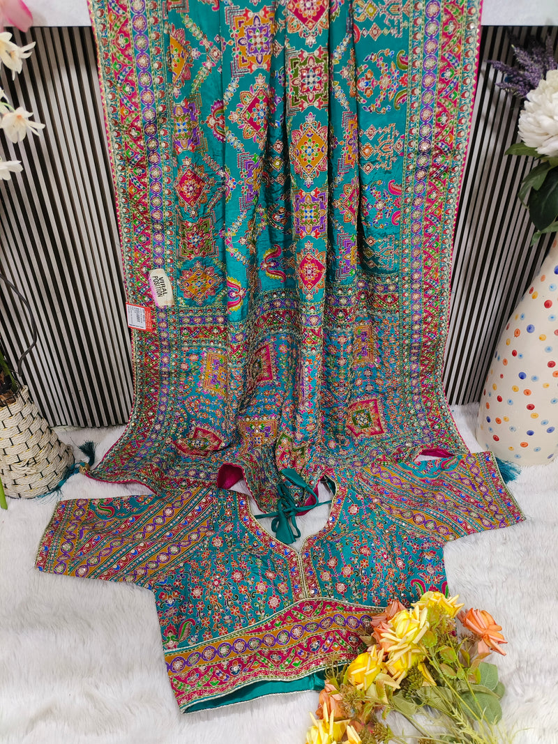Vibrant Teal Blue Silk Saree with Multicolour Embroidered Patola Motifs
