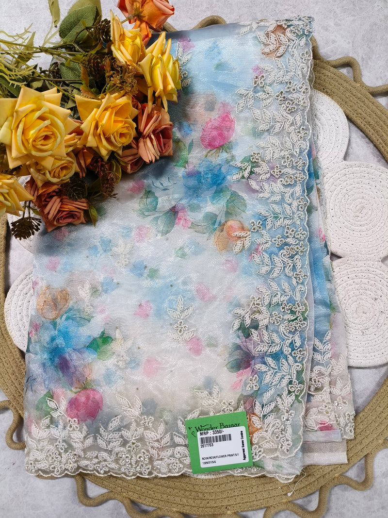Graceful White Floral Organza Saree with Intricate Pearl and Lace Borders