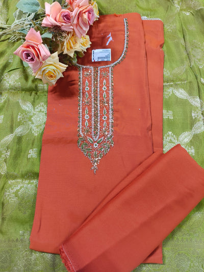 Sophisticated Rust Orange Suit with Intricate Zari and Stone Work Neckline