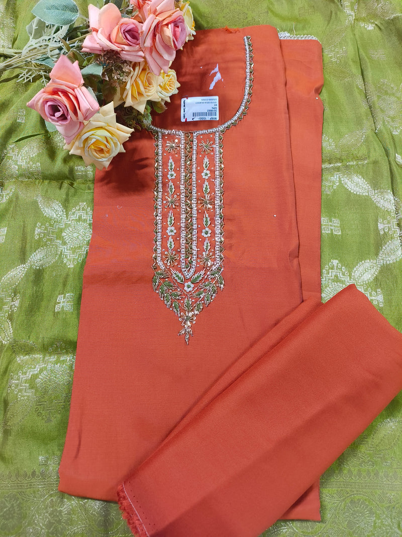 Sophisticated Rust Orange Suit with Intricate Zari and Stone Work Neckline