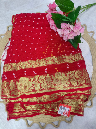 Vibrant Red Bandhani Print Saree with Intricate Gold Embellishments