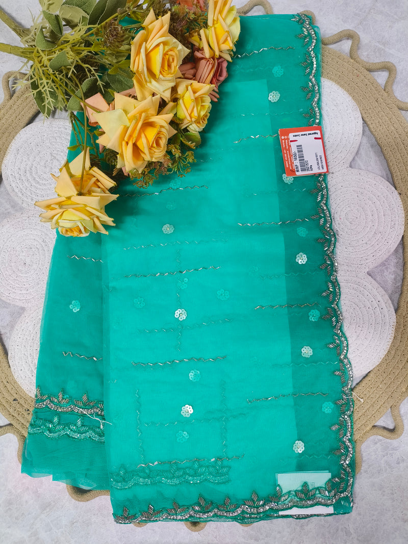 Vibrant Teal Green Embellished Saree with Silver Accents