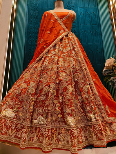 Classic Amber-Orange Bridal Lehenga with Intricate Traditional Motifs