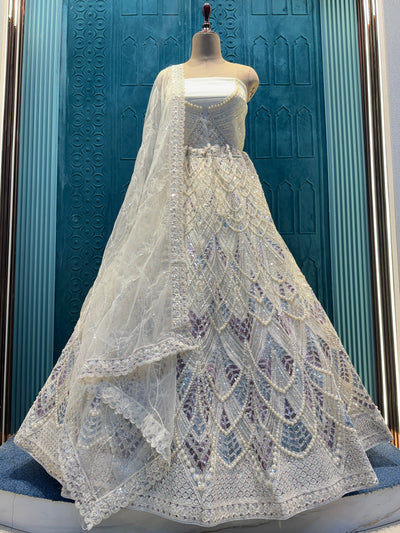 Glamorous Butter Cream Lehenga Choli with Intricate Pearl & Sequin Work