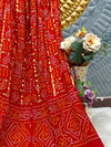 Radiant Red Bandhani Georgette Saree with Gold Zari Border